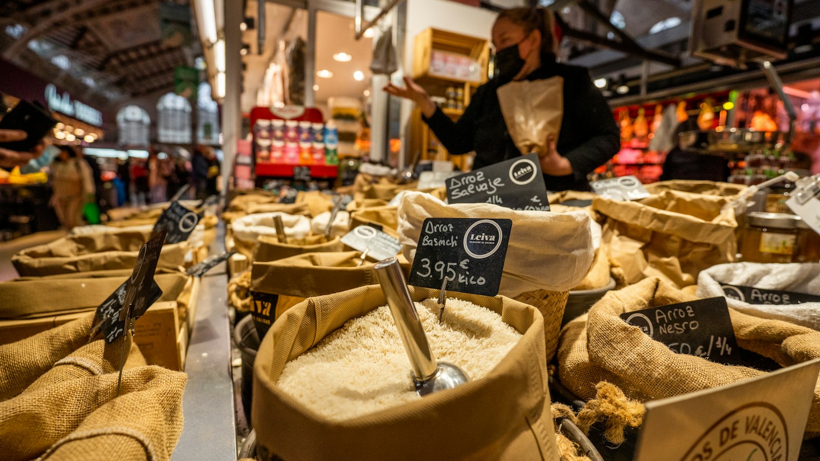 Sacks of rice with euro price labels at a food market stall in Valencia, Spain