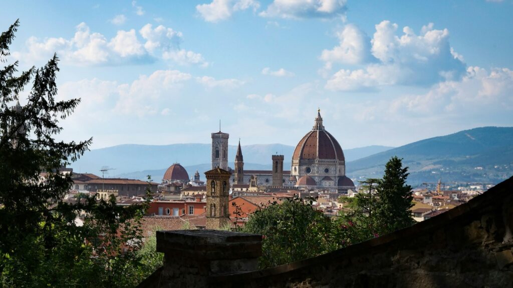 The rooftops of Florence and the Duomo under a blue sky, Italy