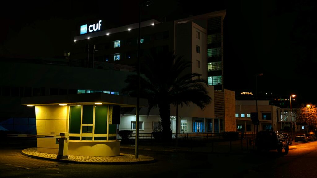 A CUF private hospital building in Portugal at night