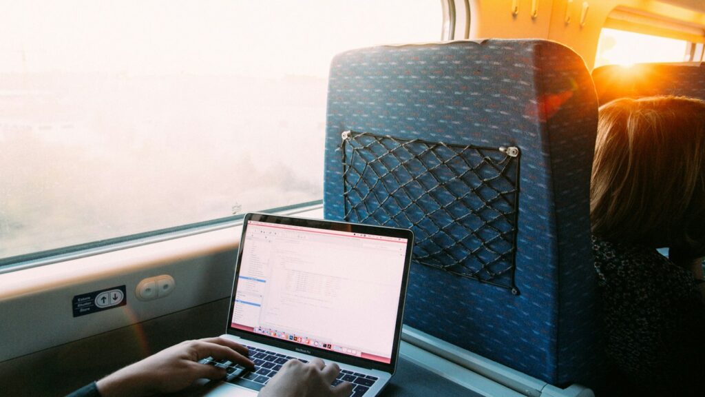 A laptop being used on a train travelling from Lisbon to Faro, Portugal