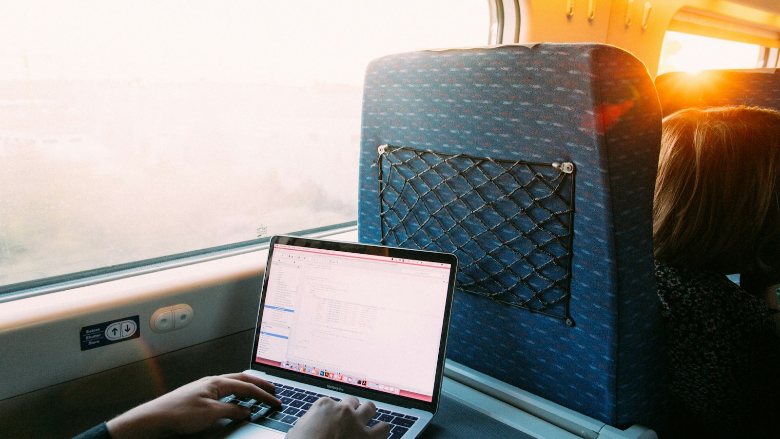 A laptop being used on a train travelling from Lisbon to Faro, Portugal
