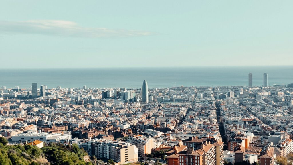 Aerial view of Barcelona stretching down to the sea, Spain